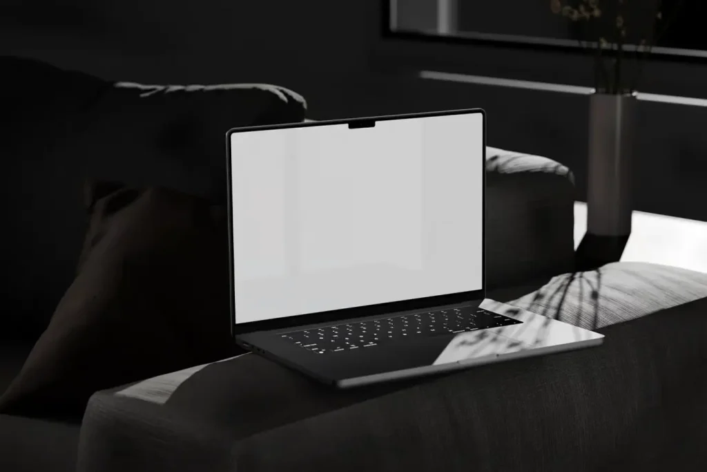 Perspective View of MacBook Pro Mockup on Settee