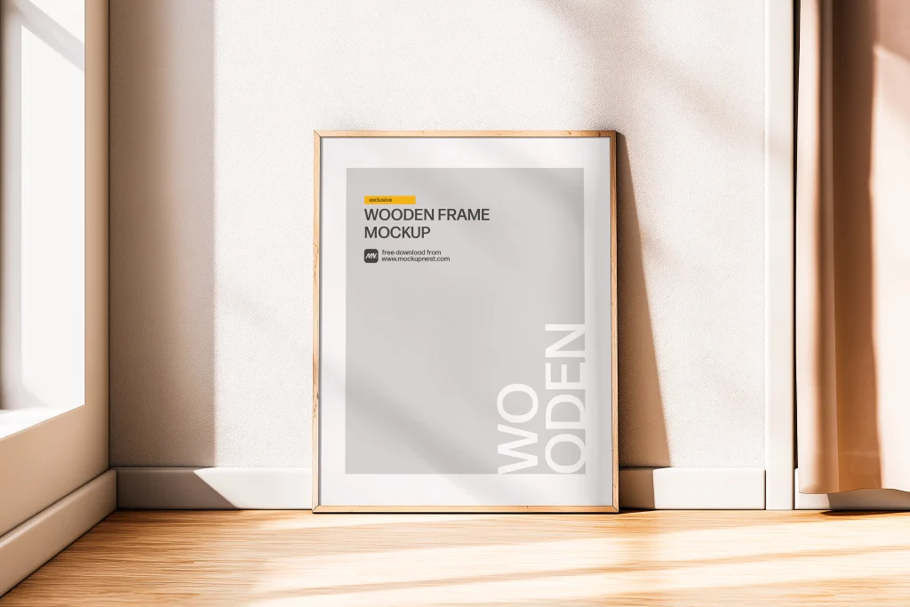 Free Minimal Wooden Frame Poster Mockup in Bright Sunlit Room Free Minimal Wooden Frame Poster Mockup in Bright Sunlit Room