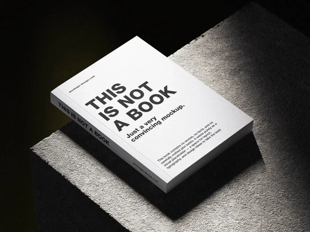 Softcover book on concrete mockup