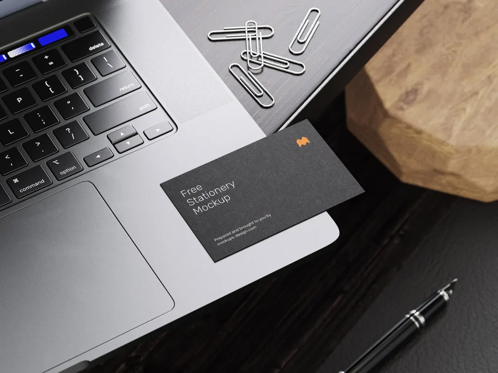 Stationery on the wooden desk mockup