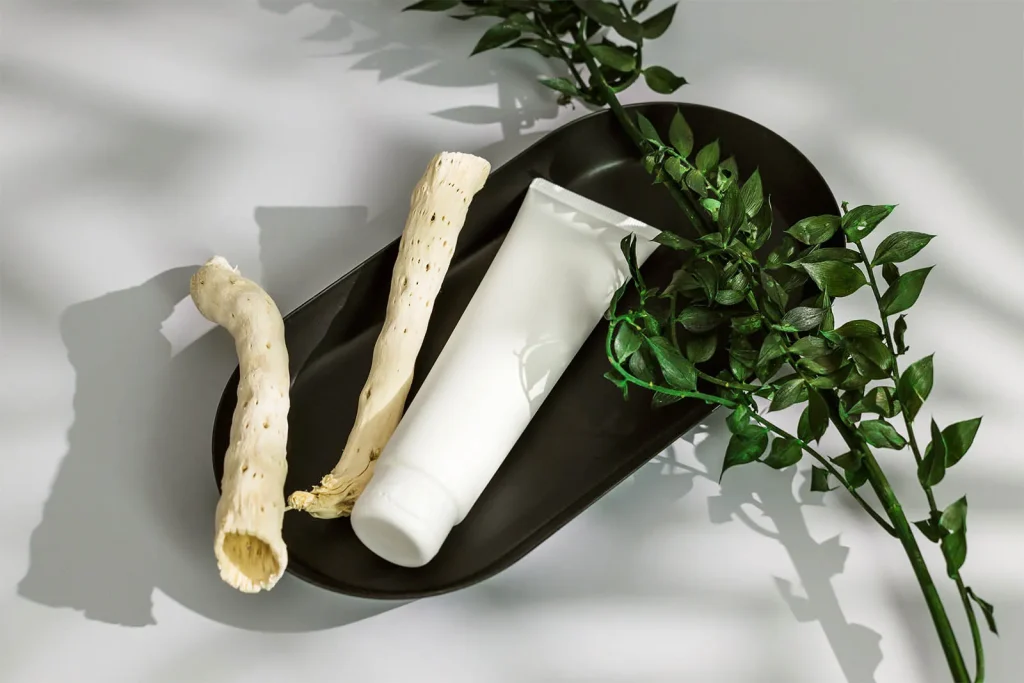 Free Cosmetic tube in black tray mockup