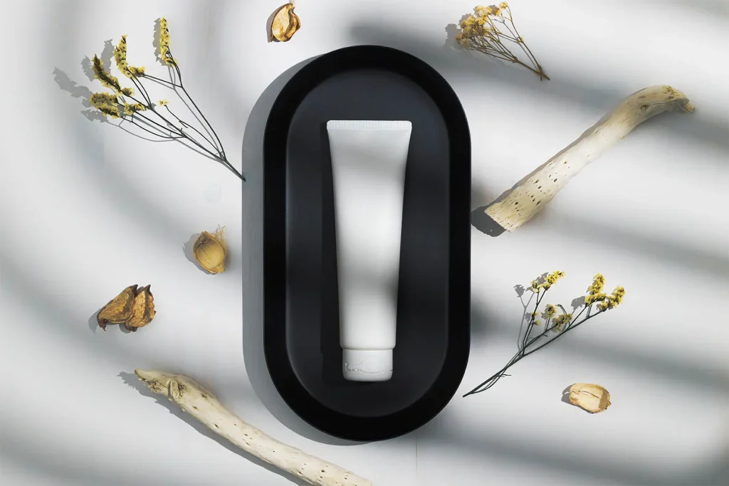 Cosmetic tube on a black tray mockup