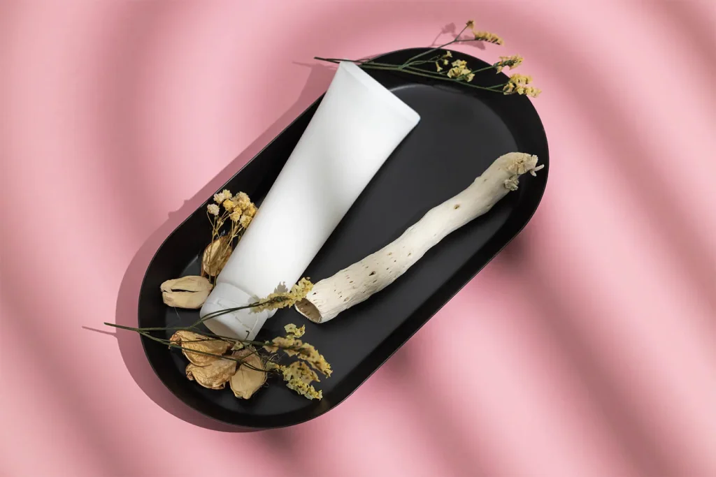 Free Cosmetic tube on black tray mockup Cosmetic tube on black tray mockup