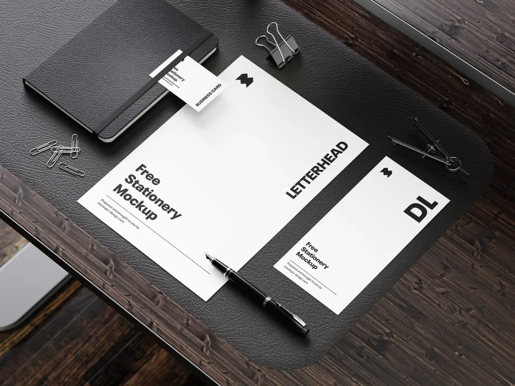 Stationery on the wooden desk mockup