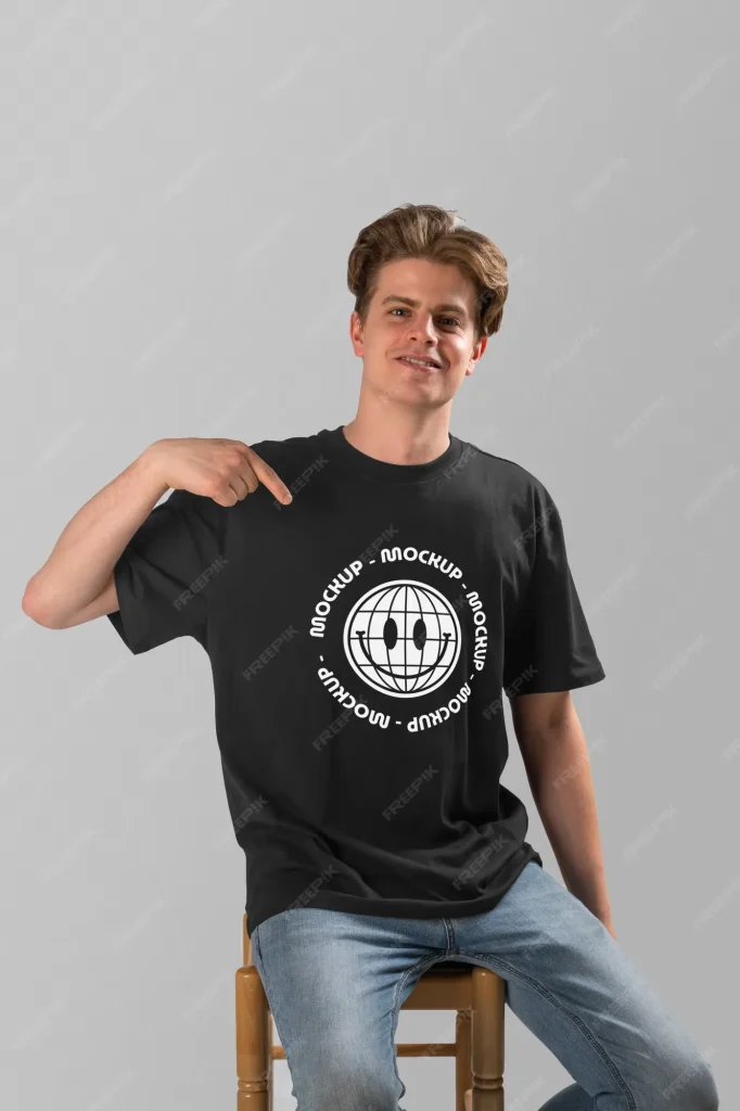 Person wearing t-shirt mock-up and pointing