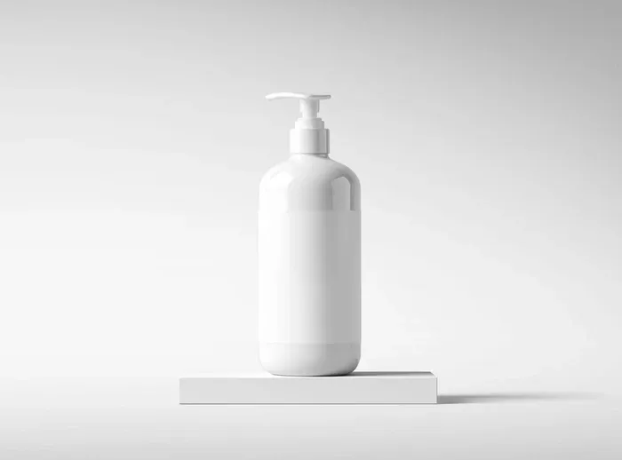 Free Lotion Bottle Mockup on White Platform