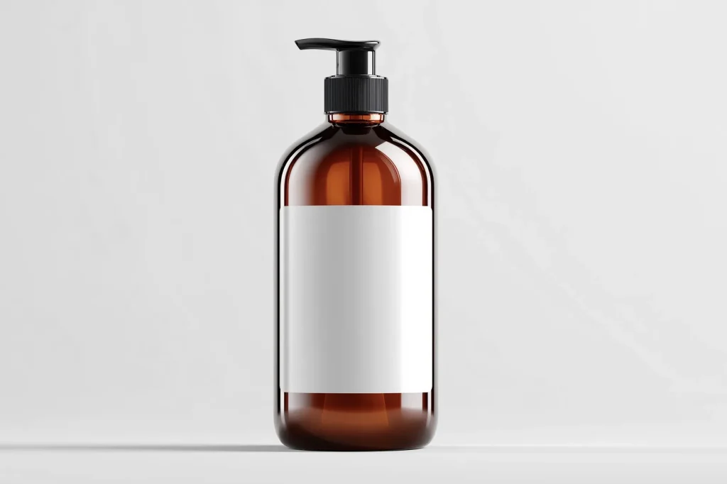 Free Amber Cosmetic Bottle Mockup in Studio Light